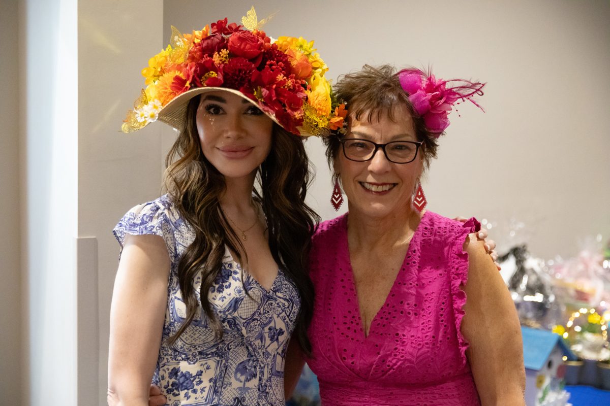 Members in floral hats at the Cottage Tea